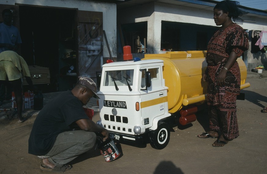 ghana, south, nungua, craftsman painting oil tanker shaped coffin for driver peter borkety kuwono following tradition of decorating coffin to reflect the life of the deceased. Nungua South GHANA EDITO ...