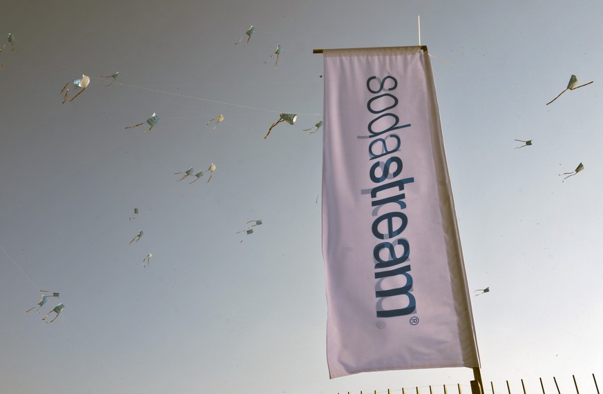 epa06959984 (FILE) - A view of kites seen behind the company flag at the SodaStream factory in the Bedouin town of Rahat, Israel in the Negev Desert, 13 June 2018 (reissued 20 August 2018). Reports on ...