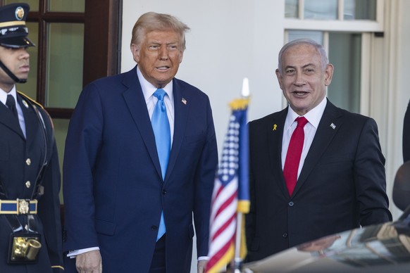 epa11875516 US President Donald Trump (L) greets Israeli Prime Minister Benjamin Netanyahu (R) as he arrives for a bilateral meeting with the president outside the West Wing of the White House in Wash ...