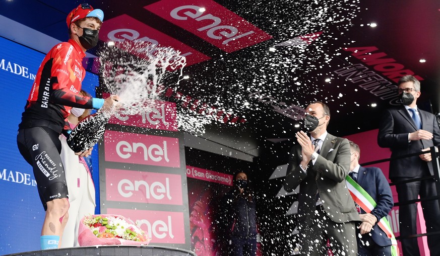 Switzerland&#039;s Gino Mader celebrates on the podium after winning the sixth stage of the Giro d&#039;Italia cycling race, from Grotte di Frasassi to Ascoli Piceno Thursday, May 13, 2021. (Gian Matt ...