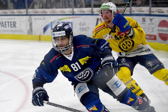 Ambri&#039;s player Thomas Ruefenacht, left, and Davos&#039; Joakim Nordstroem during the preliminary round game of National League Swiss Championship 2022/23 between, HC Ambri Piotta against HC Davos ...