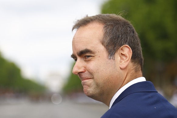 epa12237077 France&#039;s Minister of Armed Forces Sebastien Lecornu arrives to the annual Bastille Day military parade during the Bastille day celebrations in Paris, France, 14 July 2025. France cele ...