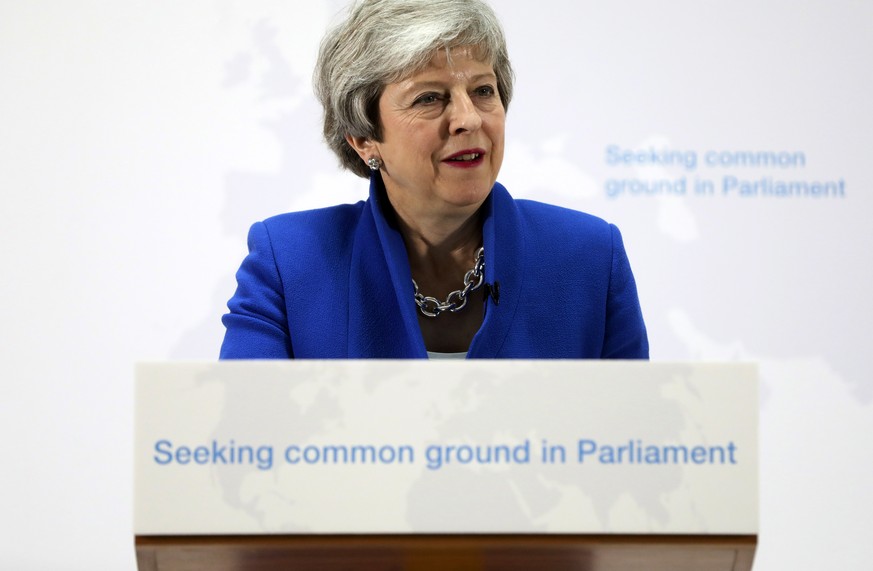 epa07589622 British Prime Minister Theresa May, delivers a speech setting out a new proposal for her Brexit deal in central London, Britain, 21 May 2019. The premier is considering tighter customs tie ...