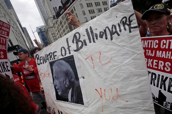 Striking workers from the Trump Taj Mahal Casino in Atlantic City, New Jersey, protest outside the offices of investor and casino owner Carl Icahn in midtown Manhattan, New York City, New York, U.S.,  ...