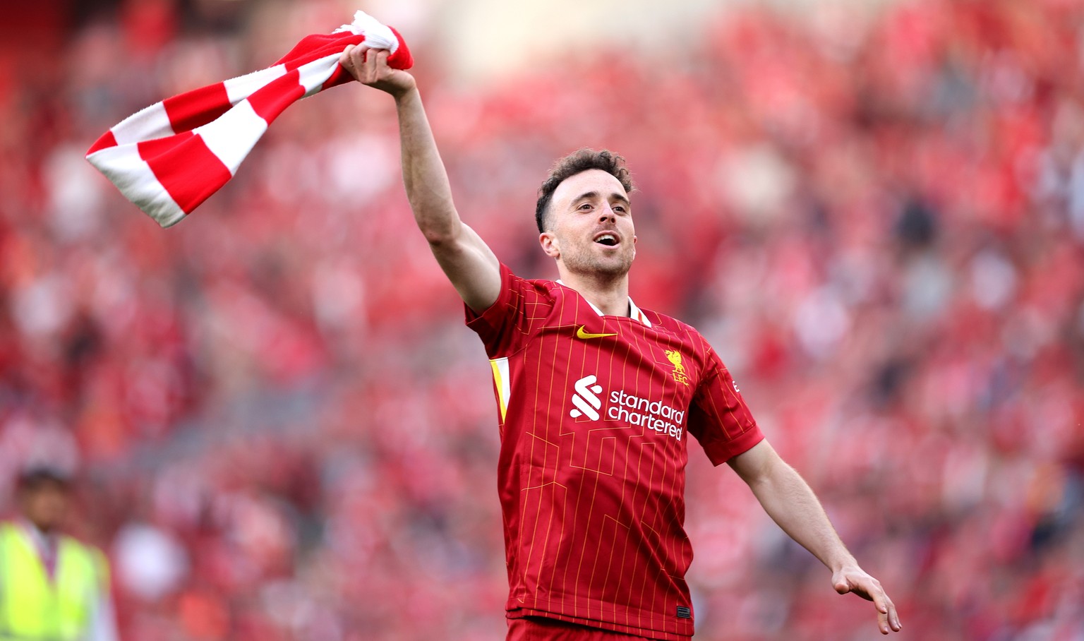 epa12059318 Liverpool player Diogo Jota celebrates in front of fans after the English Premier League soccer match between Liverpool FC and Tottenham Hotspur, in Liverpool, Britain, 27 April 2025. Live ...