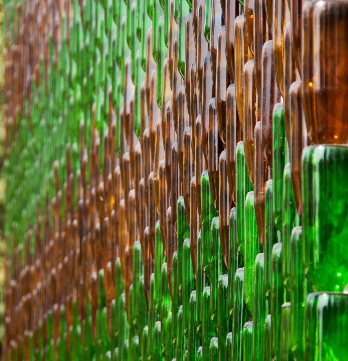 Detail of one of the walls of Wat Pa Maha Chedio Kaew, more commonly know as "The Million Bottle Temple" or "Wat Lan Kuad" in Thai. This Buddhist temple about 300 miles from Bangko ...