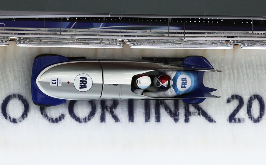 epa12745642 Romain Heinrich and Dorian Hauterville of France in action during the 2-Man of the Bobsleigh competitions at the Milano Cortina 2026 Winter Olympic Games, in Cortina d'Ampezzo, Italy, ...