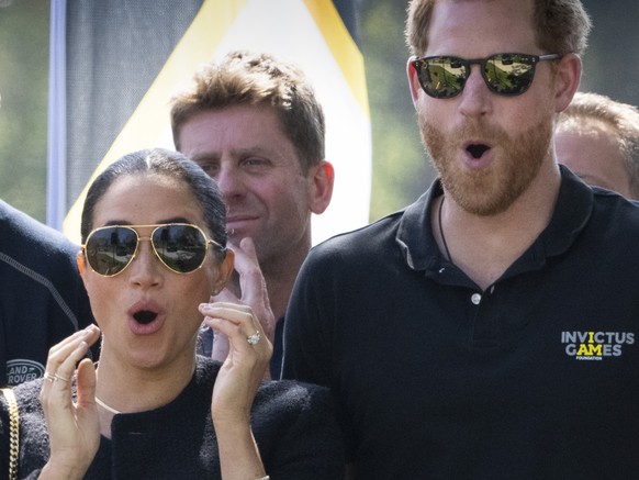 Prince Harry and Meghan Markle, Duke and Duchess of Sussex, attend the Land Rover Driving Challenge at the Invictus Games venue in The Hague, Netherlands, Saturday, April 16, 2022. The week-long games ...