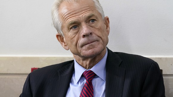 FILE - White House trade adviser Peter Navarro listens as President Donald Trump speaks during a news conference at the White House, Aug. 14, 2020, in Washington. The House committee investigating the ...