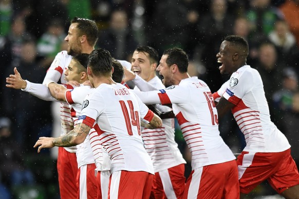 Switzerland&#039;s soccer players celebrate the 0:1 scoring by Switzerland&#039;s defender Ricardo Rodriguez, during the 2018 Fifa World Cup play-offs first leg soccer match Northern Ireland against S ...