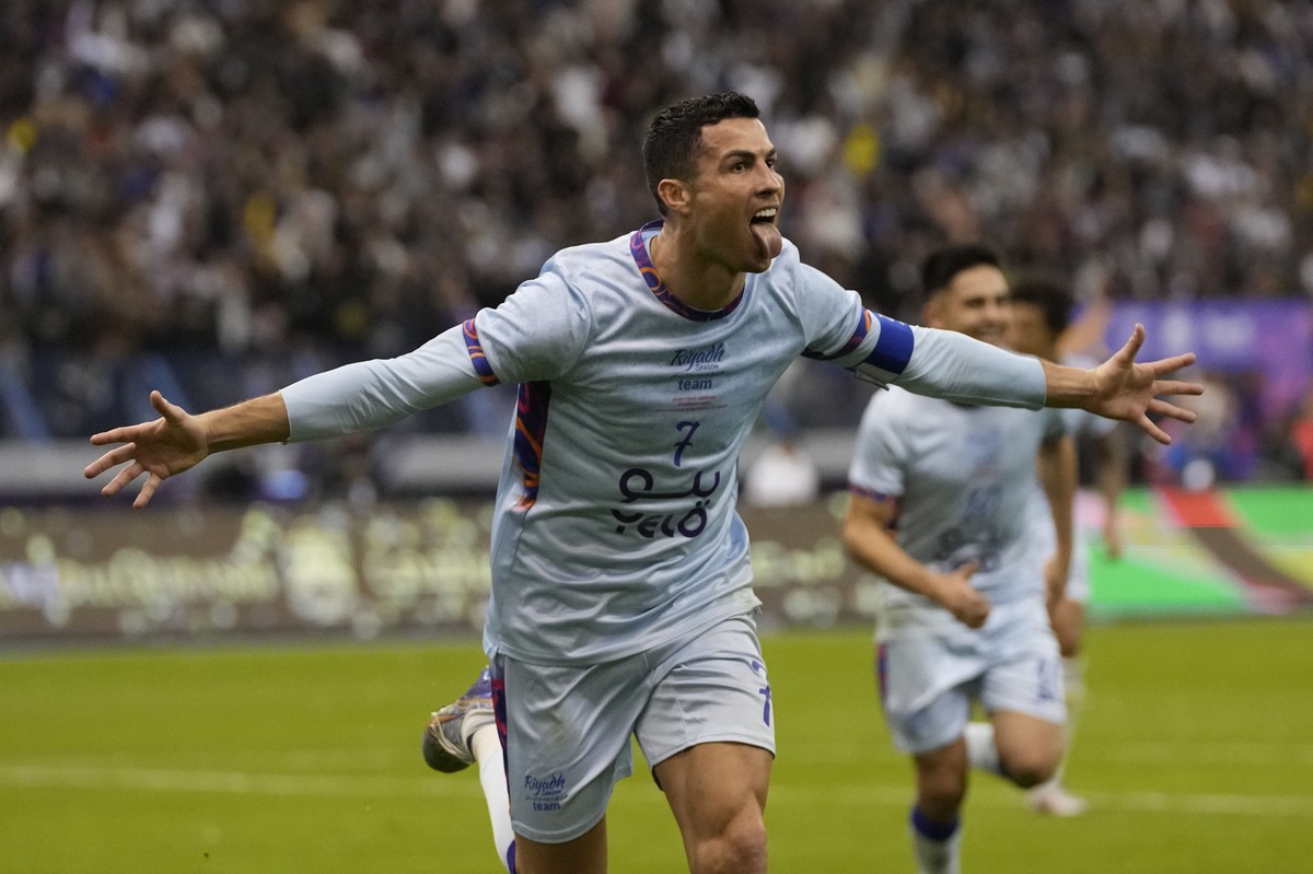 FILE - Cristiano Ronaldo celebrates after scoring his side's second goal playing for a combined XI of Saudi Arabian teams Al Nassr and PSG during a friendly soccer match, at the King Saud Univers ...
