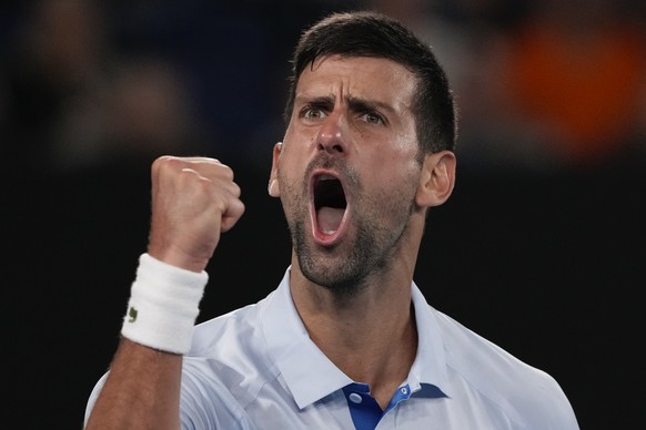 Serbia&#039;s Novak Djokovic celebrates after winning the third set against Croatia&#039;s Dino Prizmic during their first round match at the Australian Open tennis championships at Melbourne Park, Me ...