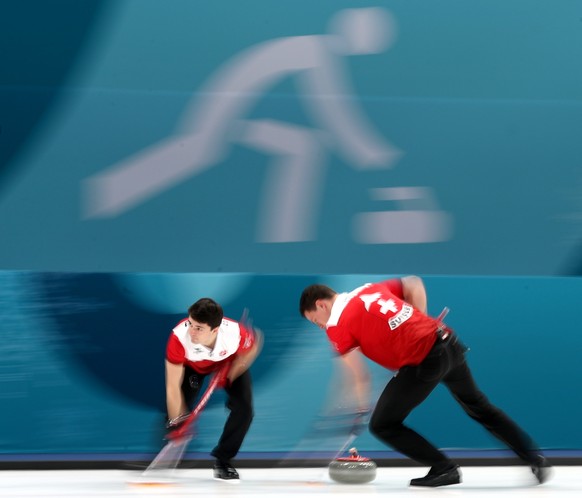 epa06551708 Benoit Schwarz (L) and Claudio Paetz of Switzerland during Men&#039;s Tie-breaker game between Switzerland and Great Britain at the Gangneung Culring Centre between, Gangneung, during the  ...