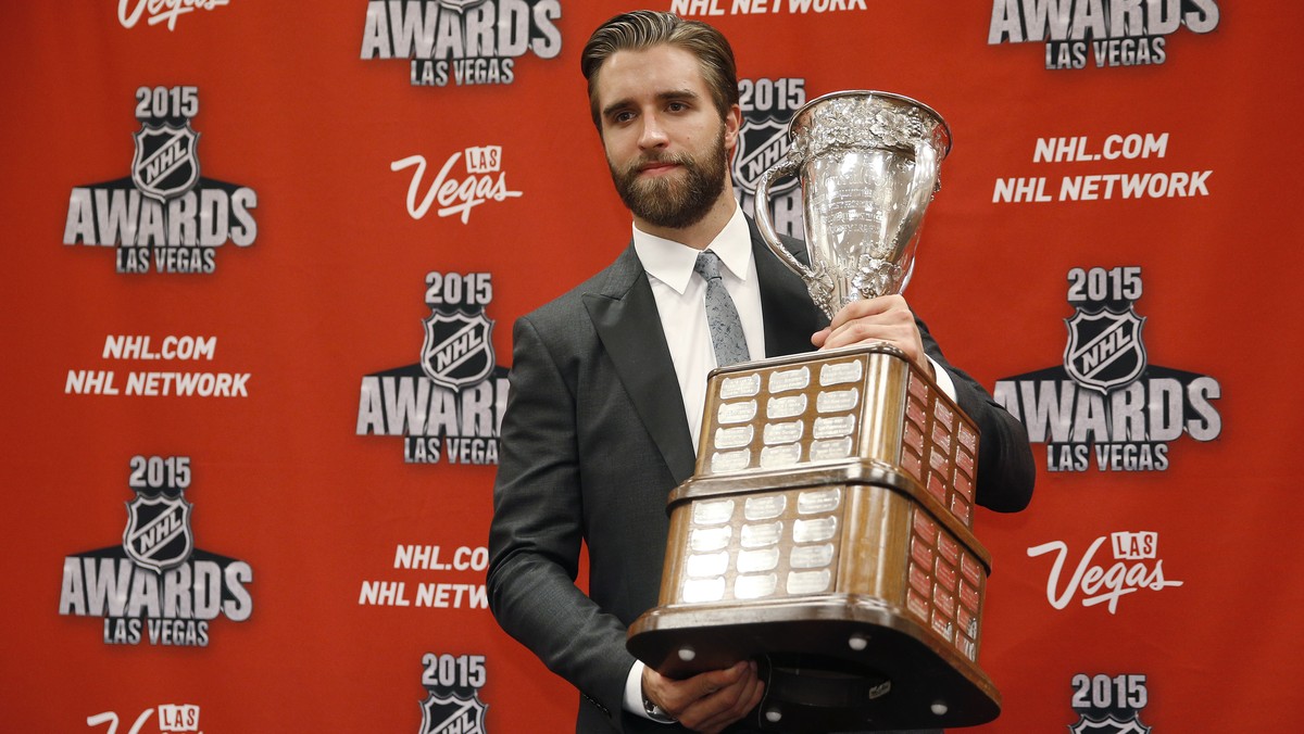 Florida Panthers' Aaron Ekblad poses with the Calder Memorial Trophy after winning the award at the NHL Awards show Wednesday, June 24, 2015, in Las Vegas. (AP Photo/John Locher)