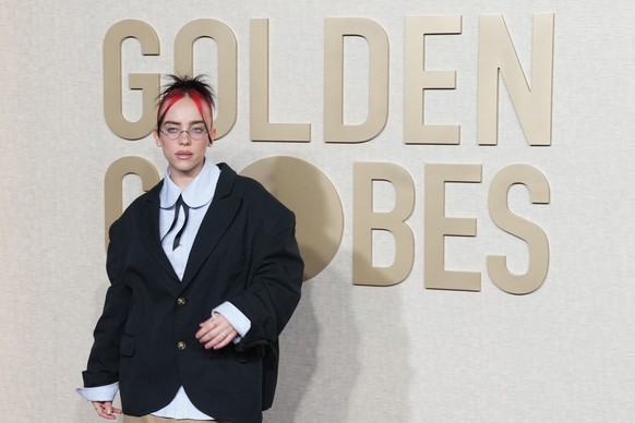 epa11063421 US singer Billie Eilish arrives for the 81st annual Golden Globe Awards ceremony at the Beverly Hilton Hotel in Beverly Hills, California, USA, 07 January 2024. Artists in various film and ...
