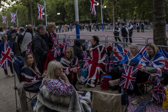 People camp out on The Mall on the eve of the funeral of Queen Elizabeth II in London, England, Sunday, Sept. 18, 2022. The funeral of Queen Elizabeth II, Britain&#039;s longest-reigning monarch, take ...