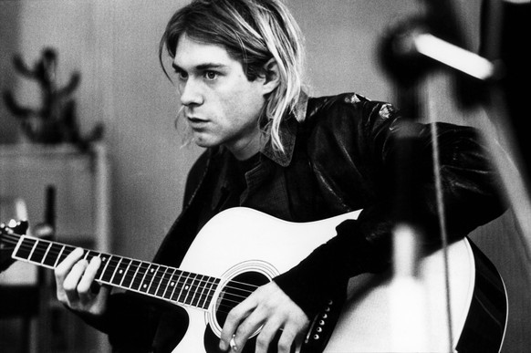 NETHERLANDS - NOVEMBER 25: HILVERSUM Photo of Kurt COBAIN and NIRVANA, Kurt Cobain recording in Hilversum Studios, playing Takamine acoustic guitar (Photo by Michel Linssen/Redferns)