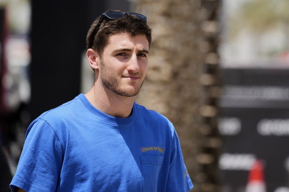 Alpine driver Jack Doohan of Australia walks through the paddock ahead of the Formula One Bahrain Grand Prix at the Bahrain International Circuit in Sakhir, Thursday, April 10, 2025. (AP Photo/Darko B ...