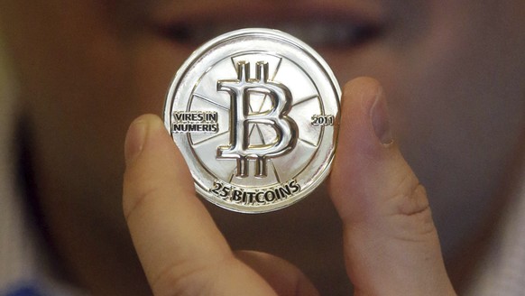 FILE - In this April 3, 2013 photo, a 25 Bitcoin token is displayed in Sandy, Utah. (AP Photo/Rick Bowmer, File)
Trump Crypto