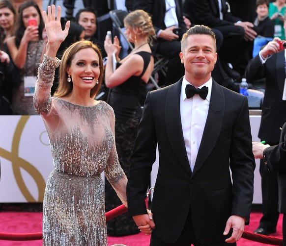 FILE - In this Sunday, March 2, 2014, file photo, Angelina Jolie, left, and Brad Pitt arrive at the Oscars at the Dolby Theatre in Los Angeles. Jolie and Pitt were married Saturday, Aug. 23, 2014, in  ...