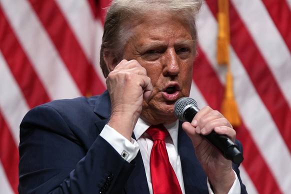 Republican presidential nominee former President Donald Trump speaks with Tucker Carlson during a Tucker Carlson Live Tour show at Desert Diamond Arena, Thursday, Oct. 31, 2024, in Glendale, Ariz. (AP ...