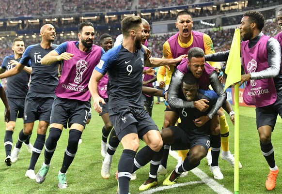 France&#039;s Paul Pogba, third from right, celebrates with his teammates after scoring his side&#039;s third goal during the final match between France and Croatia at the 2018 soccer World Cup in the ...