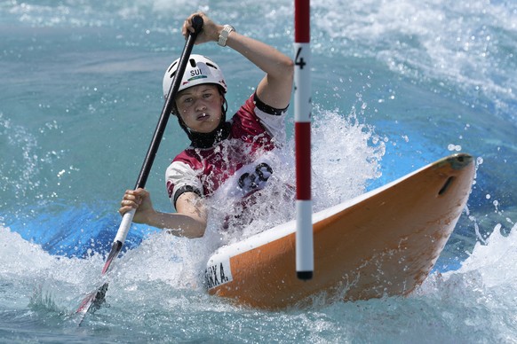 Alena Marx of Switzerland competes in the Women's C1 heats of the Canoe Slalom at the 2020 Summer Olympics, Wednesday, July 28, 2021, in Tokyo, Japan. (AP Photo/Kirsty Wigglesworth)