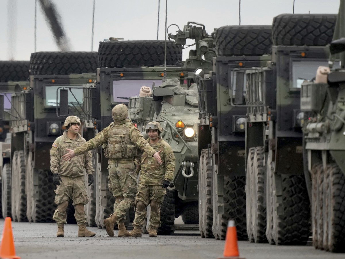 Soldiers of the 2nd Cavalry Regiment line up vehicles at the military airfield in Vilseck, Germany, Wednesday, Feb. 9, 2022 as they prepare for the regiment's movement to Romania loading of Stryk ...