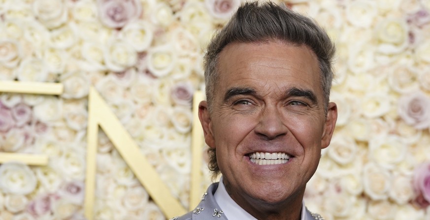 Robbie Williams arrives at the 82nd Golden Globes on Sunday, Jan. 5, 2025, at the Beverly Hilton in Beverly Hills, Calif. (Photo by Jordan Strauss/Invision/AP)
Robbie Williams
