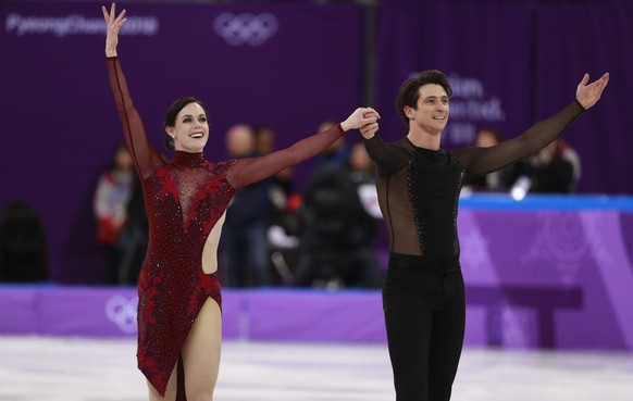 epa06516594 Tessa Virtue and Scott Moir of Canada after they competed in the Ice Dance Free Dance of the Figure Skating Team Event to bring home Canada a gold medal in the competition at the Gangneung ...