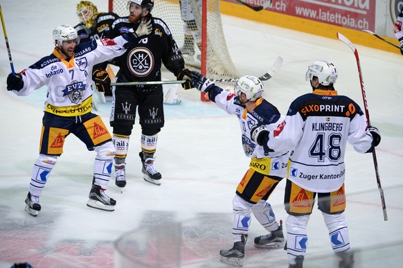 Zug&#039;s players David McIntyre, Dominic Lammer and Carl Klingberg, from left, celebrate the 2-2 goal, during the preliminary round game of National League Swiss Championship 2017/18 between HC Luga ...