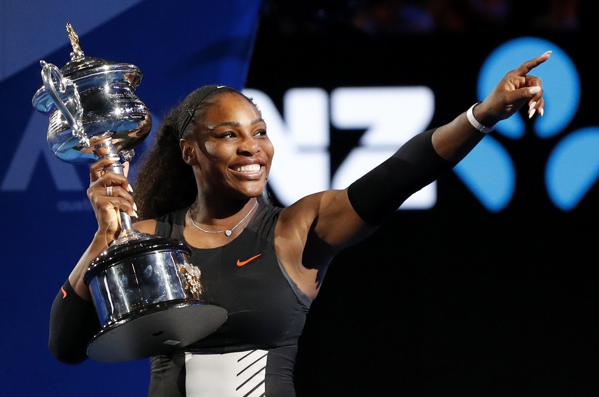 United States' Serena Williams holds her trophy after defeating her sister Venus during the women's singles final at the Australian Open tennis championships in Melbourne, Australia, Saturda ...