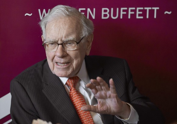 FILE - Warren Buffett, Chairman and CEO of Berkshire Hathaway, speaks during a game of bridge after the annual Berkshire Hathaway shareholders meeting in Omaha, Neb., on May 5, 2019. A recent report f ...
