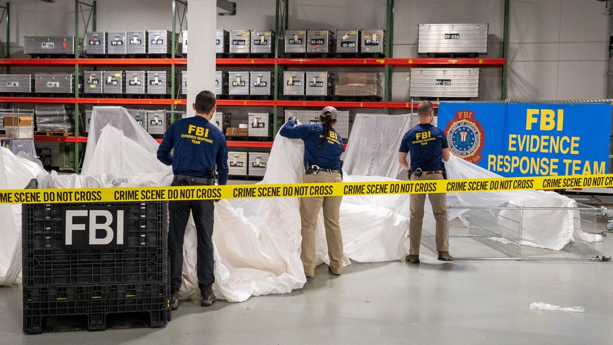 epa10458042 A handout photo made available by the FBI shows members a Federal Bureau of Investigation Evidence Response Team processing pieces of the Chinese high-altitude balloon that the United Stat ...
