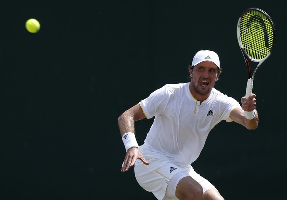 Germany&#039;s Mischa Zverev plays a return against Kazakstan&#039;s Mikhail Kukushkin during their Men&#039;s Singles Match on day four at the Wimbledon Tennis Championships in London Thursday, July  ...