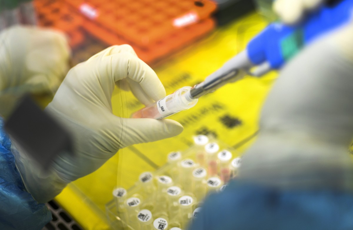 In this Thursday, Feb. 6, 2020, photo, an employee works in the pop-up Huoyan Laboratory specialized in the nucleic acid test on 2019-nCoV in Wuhan in central China's Hubei province. The coronavi ...