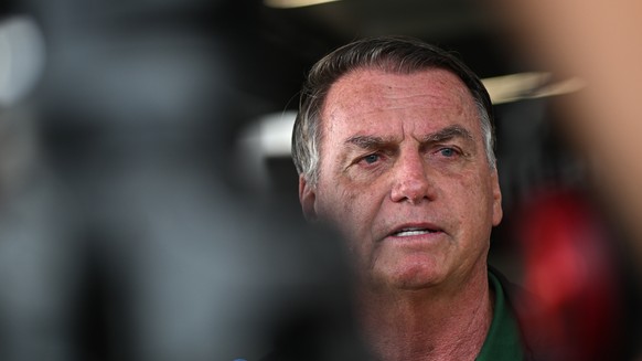 epa11987550 Brazil&#039;s former president Jair Bolsonaro (2019-2022) reacts upon his arrival at Brasilia airport, in Brasilia, Brazil, 25 March 2025. Brazil&#039;s Supreme Court began the first of th ...