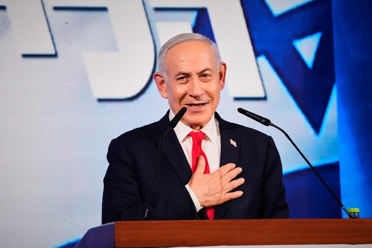 Israeli Prime Minister Benjamin Netanyahu speaks to his supporters at Likud party headquarters in Jerusalem after the release of the first exit poll results in Israel's general election, Wednesda ...