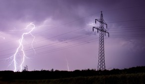 epaselect epa04247274 Lightning bolts illuminate the sky as they strike near high voltage power lines in Sehnde, near Hanover, northern Germany, early 10 June 2014. Thunderstorms with heavy rains and hail are passing over parts of Germany.  EPA/JULIAN STRATENSCHULTE