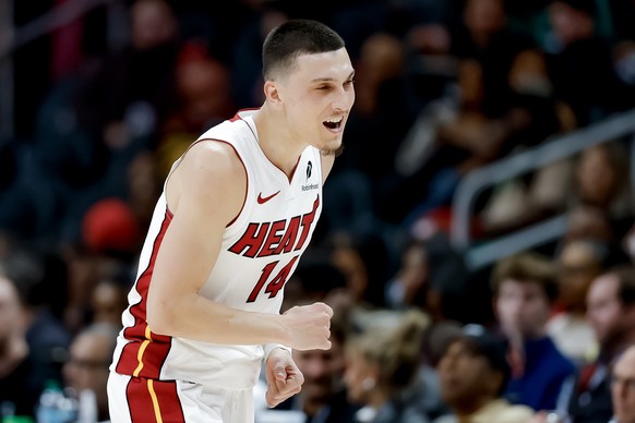 epa12764020 Miami Heat guard Tyler Herro reacts after making a three-point basket against the Atlanta Hawks during the second half of an NBA basketball game between the Miami Heat and the Atlanta Hawk ...