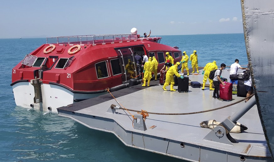 epa08248377 A handout photo made available by Indonesian National Armed Forces (TNI) shows Indonesian citizen arriving on board the KRI Dr Soeharso hospital ship, after being evacuated from the World  ...