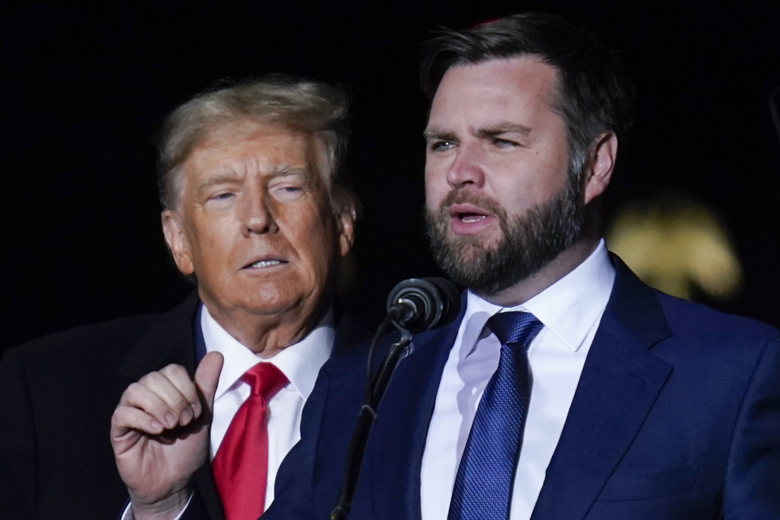 FILE - Republican Ohio Senate candidate JD Vance speaks as Republican presidential candidate former President Donald Trump listens at a campaign rally at Wright Bros. Aero Inc. at Dayton International ...
