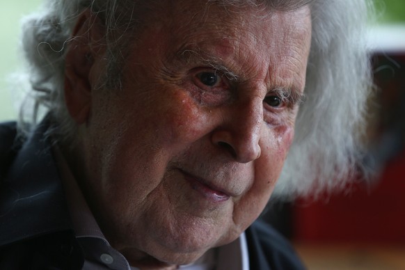 epa09442248 (FILE) - Greek composer Mikis Theodorakis, 92, presents his last book &#039;Monologues in the twilight&#039;, in his home in Athens, 30 March 2017 (reissued 02 September 2021). The legenda ...