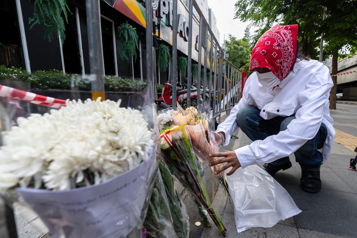 A man puts flowers outside the music bar where a fire killed a number of people in Bangkok, Thailand, Tuesday, July 14, 2026. (AP Photo/Wason Wanichakorn)
Thailand Fire