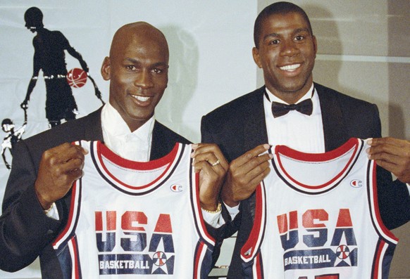 FILE - This Sept. 21, 1991 file photo shows Michael Jordan, left, and Earvin "Magic" Johnson holding their uniforms for the 1992 US Olympic Basketball team in Chicago. Cleveland Cavaliers st ...