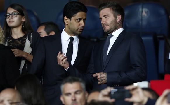 epa07851998 Paris Saint Germain president and CEO Nasser Al-Khelaifi (L) and former English soccer player David Beckham (R) during the UEFA Champions League Group A soccer match between Paris Saint Ge ...