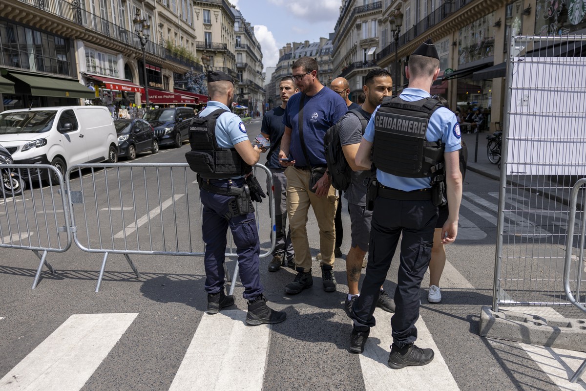 epa11494145 French policemen control people who want to access the Louvre museum at a checkpoint amid preparations for the opening ceremony of the Paris 2024 Olympic Games, in Paris, France, 24 July 2 ...