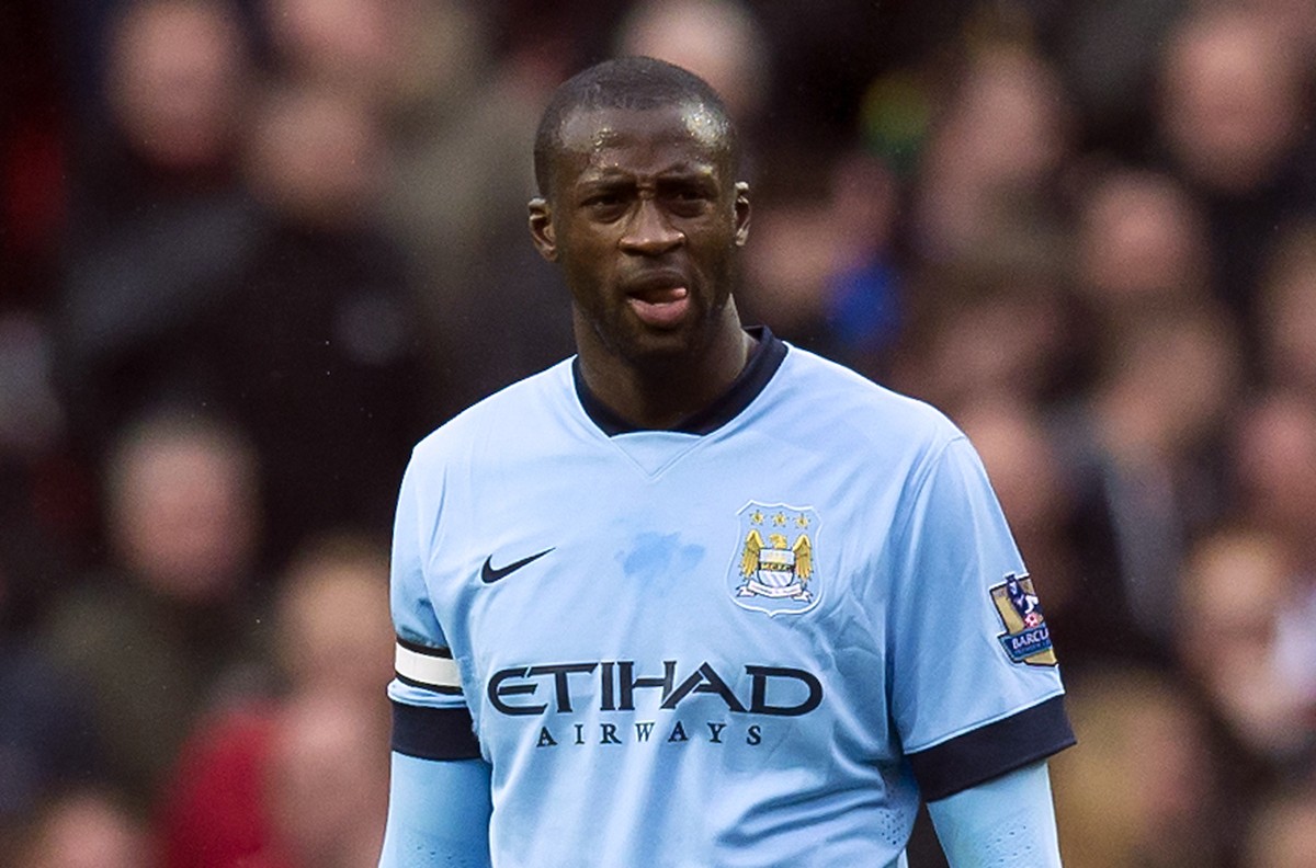 FILE - In this Sunday, April 12, 2015 file photo, Manchester City's Yaya Toure waits for play to resume during the English Premier League soccer match between Manchester United and Manchester Cit ...