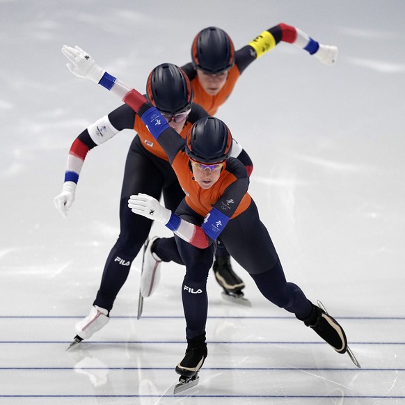 Team Netherlands, led by Ireen Wust, with Antoinette De Jong center and Irene Schouten behind, competes in the speedskating women's team pursuit quarterfinals at the 2022 Winter Olympics, Saturday, Feb. 12, 2022, in Beijing. (AP Photo/Sue Ogrocki)