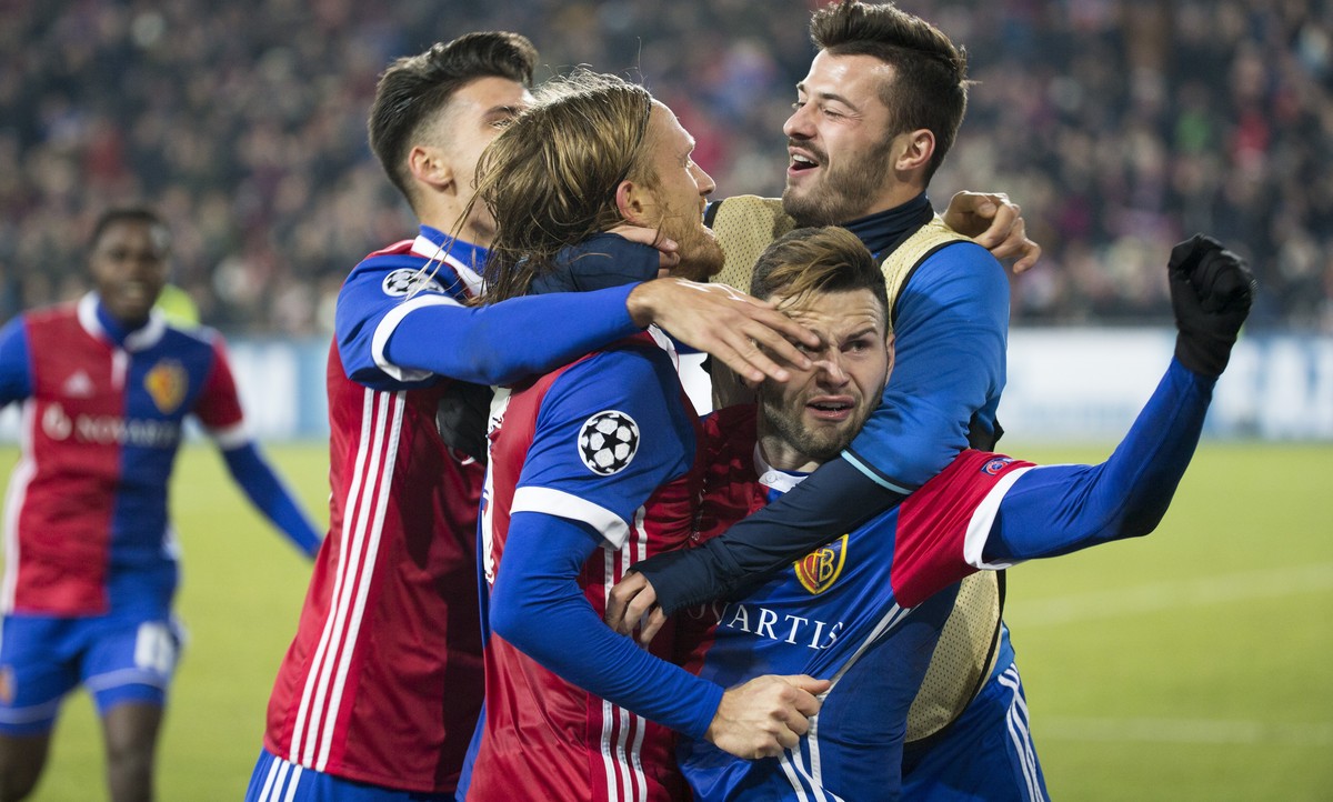 Basel's Michael Lang, center, celebrates with his teammates the first goal during the UEFA Champions League Group stage Group A matchday 5 soccer match between Switzerland's FC Basel 1893 an ...